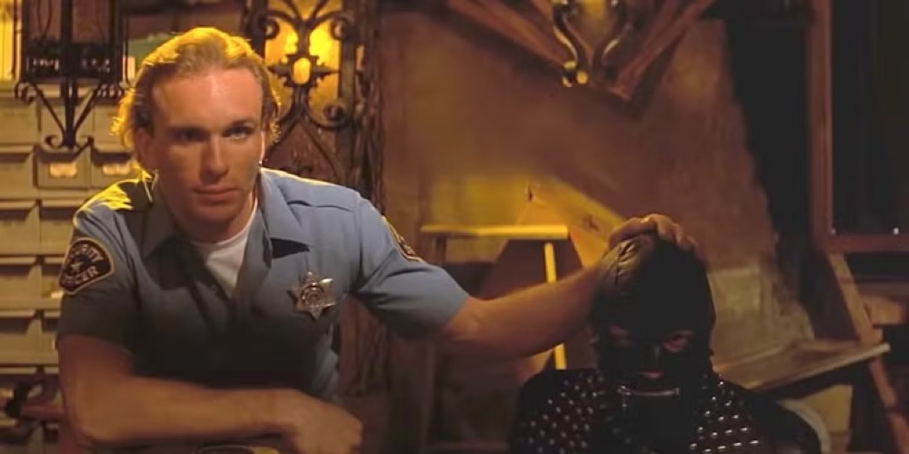 Peter Greene as Zed with the Gimp in Pulp Fiction